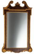 A 19th Century and later walnut veneer and gilt decorated mirror in the George II manner,