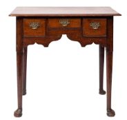 A George II oak lowboy side table, circa 1740; the top with ovolo moulded edges,