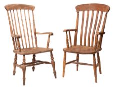 An oak and elm spindle back elbow chair, 19th century; with serpentine armrests, shaped seat,