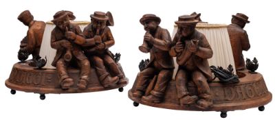A pair of 'Black Forest' carved oak figural electroliers,