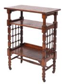 An oak library bookstand in Arts and Crafts style, designed by Leonard Wyburd for Liberty & Co.