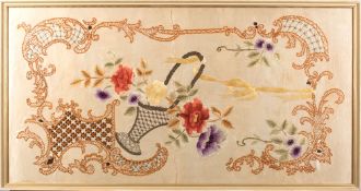 A Japanese silk embroidered panel of a basket of flowers within an elaborate scrollwork border,
