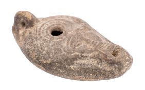 A Roman pottery oil lamp, probably 2nd/3rd century A,D.
