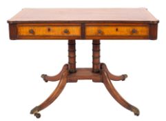 A Regency mahogany and inlaid library table, bordered with boxwood and ebony lines,