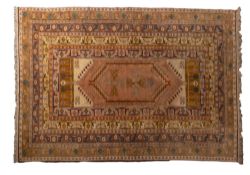 A Genge carpet, the beige filed with a hexagonal stepped panel with cruciform designs,