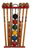 A children's part painted and turned wood croquet set, mid 20th century; the six mallets,