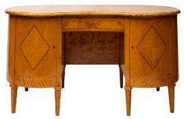 A Swedish satinwood and line inlaid kidney shaped desk, in Art Deco style,