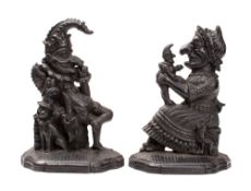 A pair of Victorian iron door porters relief cast as Mr Punch and Judy,