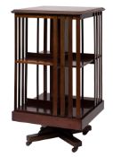 An Edwardian mahogany and crossbanded revolving bookcase,