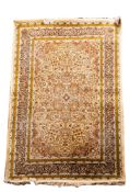 A Kashmiri rug, the ivory cartouche field with a central powder blue cartouche pole medallion,