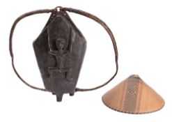 A carved and stained wood hod, probably East African,