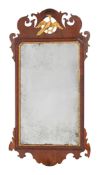 A George III mahogany and partly gilt fret carved mirror with pierced ho-ho bird cresting,