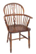 A 19th Century elm and yew-wood stick back Windsor elbow chair,