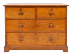 A Victorian oak chest of drawers, late 19th century; with two short and two ling drawers,