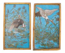 A pair of Chinese cloisonne enamel rectangular plaques decorated with cranes amongst reeds on a