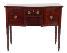 A Regency mahogany and inlaid bow-fronted sideboard of small size, bordered with ebony lines,