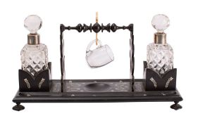 An Anglo Indian ebony and ivory inlaid decanter stand,