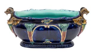 A Thomas Forester & Sons majolica blue-ground jardiniere and a small majolica duck tureen and cover