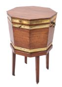 A George III mahogany and brass bound octagonal wine cooler on a stand,