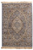 A machine made rug of Kashan design, with a pastel blue field and cartouche pole medallion ,