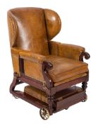 A George IV mahogany and later tan leather upholstered library or invalid's metamorphic wing