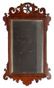 A walnut fret framed wall mirror in George I style,