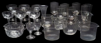A mixed group of drinking glasses, comprising eight hollow stem champagne bowls, seven rummers,