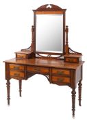An Edwardian mahogany dressing table with rectangular swing mirror,
