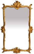 A carved and gilt wood framed wall mirror in Louis XV taste,