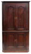 A George III oak corner cabinet,