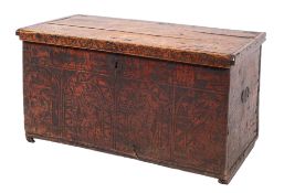 An early 17th century Italian cedar wood cassone, the front decorated with dragons beneath arches,