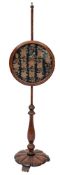 A George IV oak and petit point embroidered polescreen,