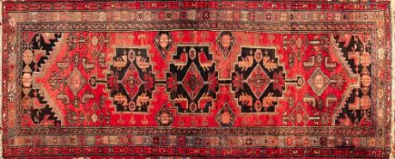 A Heriz Runner, the rose pointed field with triple chocolate brown stepped medallions,