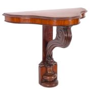 A Victorian mahogany serpentine-fronted console table, the top with a moulded edge,