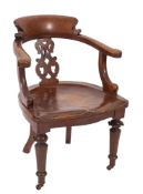 A Victorian oak desk chair,