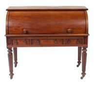 A Regency mahogany cylinder bureau, early 19th century; with rectangular top above the roll front,