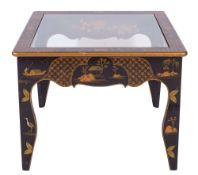 A lacquered wood and glass topped low table, early 20th century; the border of the top,
