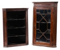 A George III glazed oak hanging corner cabinet,