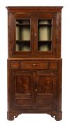 A George III oak corner cupboard,