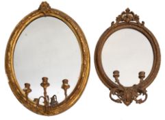 A Victorian gilt composition framed three light oval girandole,