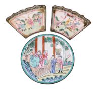 A Chinese Canton famille rose enamel dish and two similar segmented dishes the first decorated with