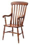 A Victorian elm, beech and oak lath back elbow chair,