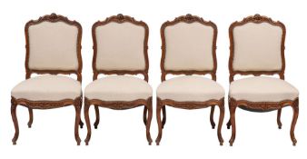 A suite of carved walnut and cream fabric upholstered salon furniture in Louis XV style,