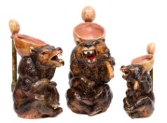 A graduated set of three Joseph Holdcroft majolica jugs each modelled as a seated brown bear,