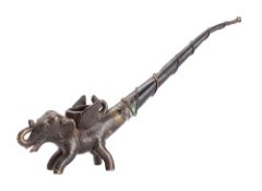 A Thai bronze and copper elephant opium pipe the long stem bound with wirework, 22cm.