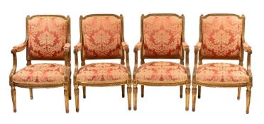 A suite of four carved and giltwood fauteuils in late Louis XV Transitional style,