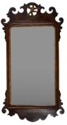 A parcel gilt walnut framed wall mirror in George I style,