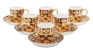 Six Royal Crown Derby coffee cans and saucers in the Imari pattern,