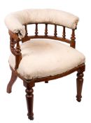 An early Victorian oak and partially upholstered library tub chair,