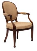 A George III mahogany open armchair in the manner of John Linnell with oval upholstered panel back,